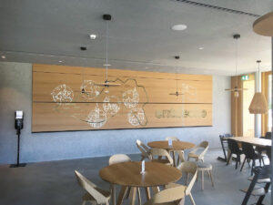 Chair with Light fixture and Light fixture showing text 'entuecke'.